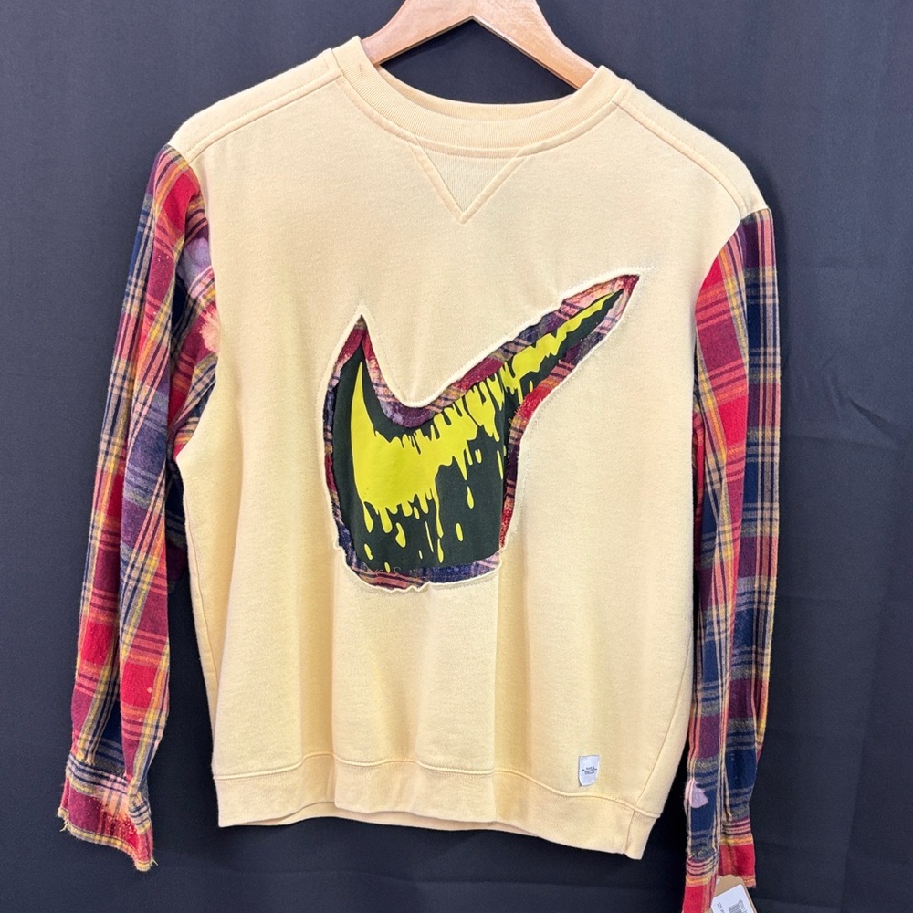 Plaid Sleeve Sweater with Graphic Design
Repurposed by “Jagged Threads”